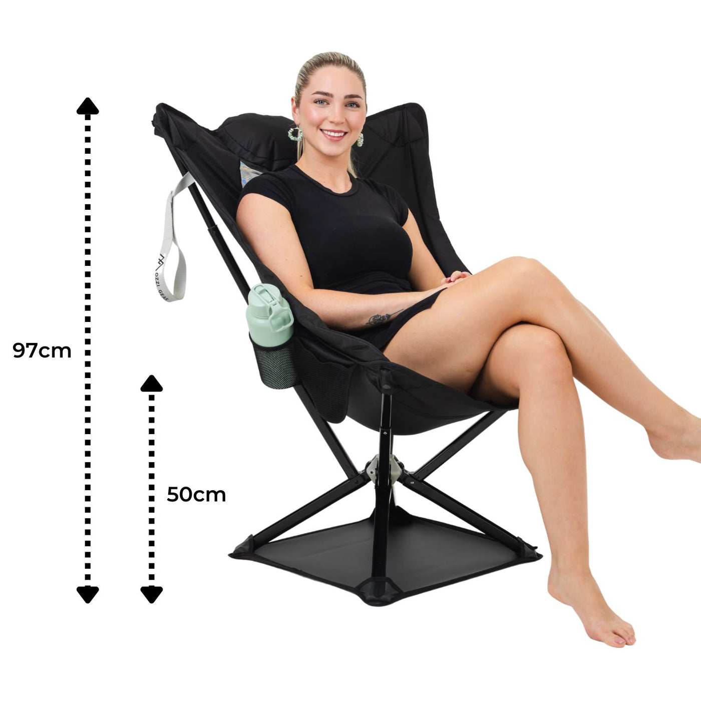 Woman sitting in a black lounge chair with measurements on a white background