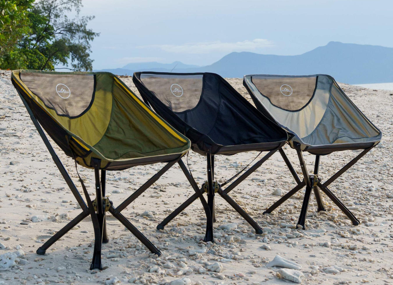 3 ozzi gear chairs lined up on the beach