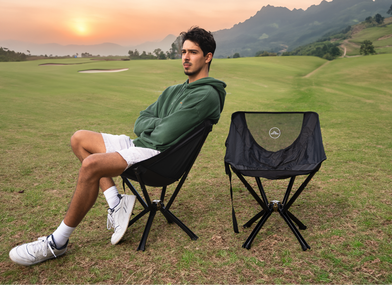 Man sitting on ozzi gear chair on golf course