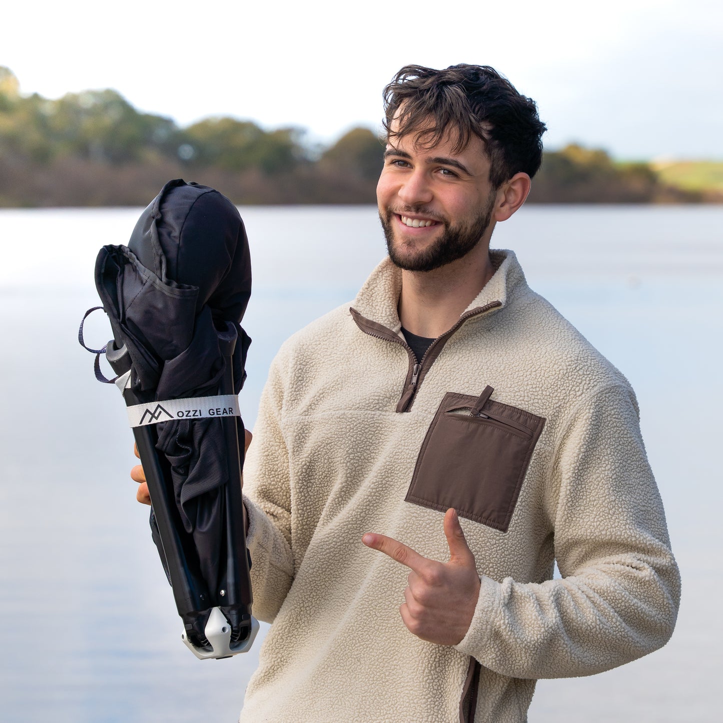 Man holding Ozzi Gear Lounger